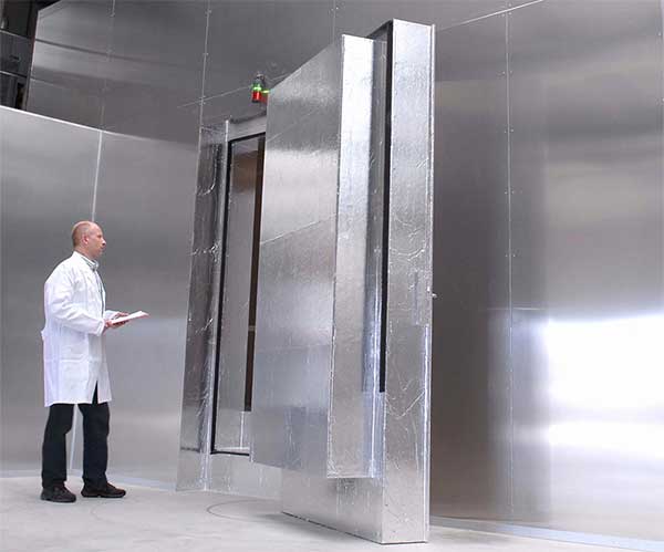 an employee standing in a room with increased energy efficiency