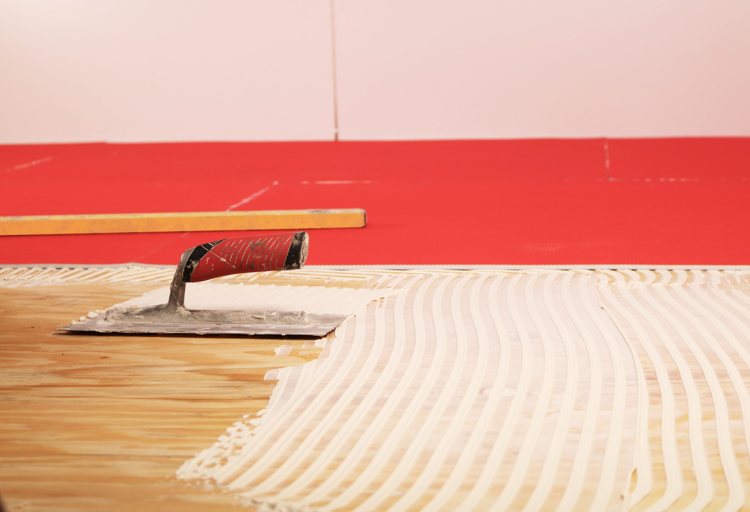 layer of insulation paste on top of wood floor