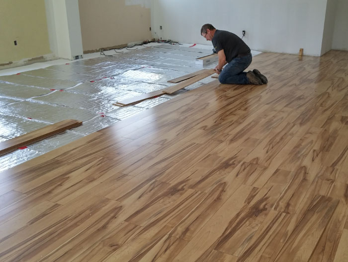 Foil radiant heaters installed under hardwood.