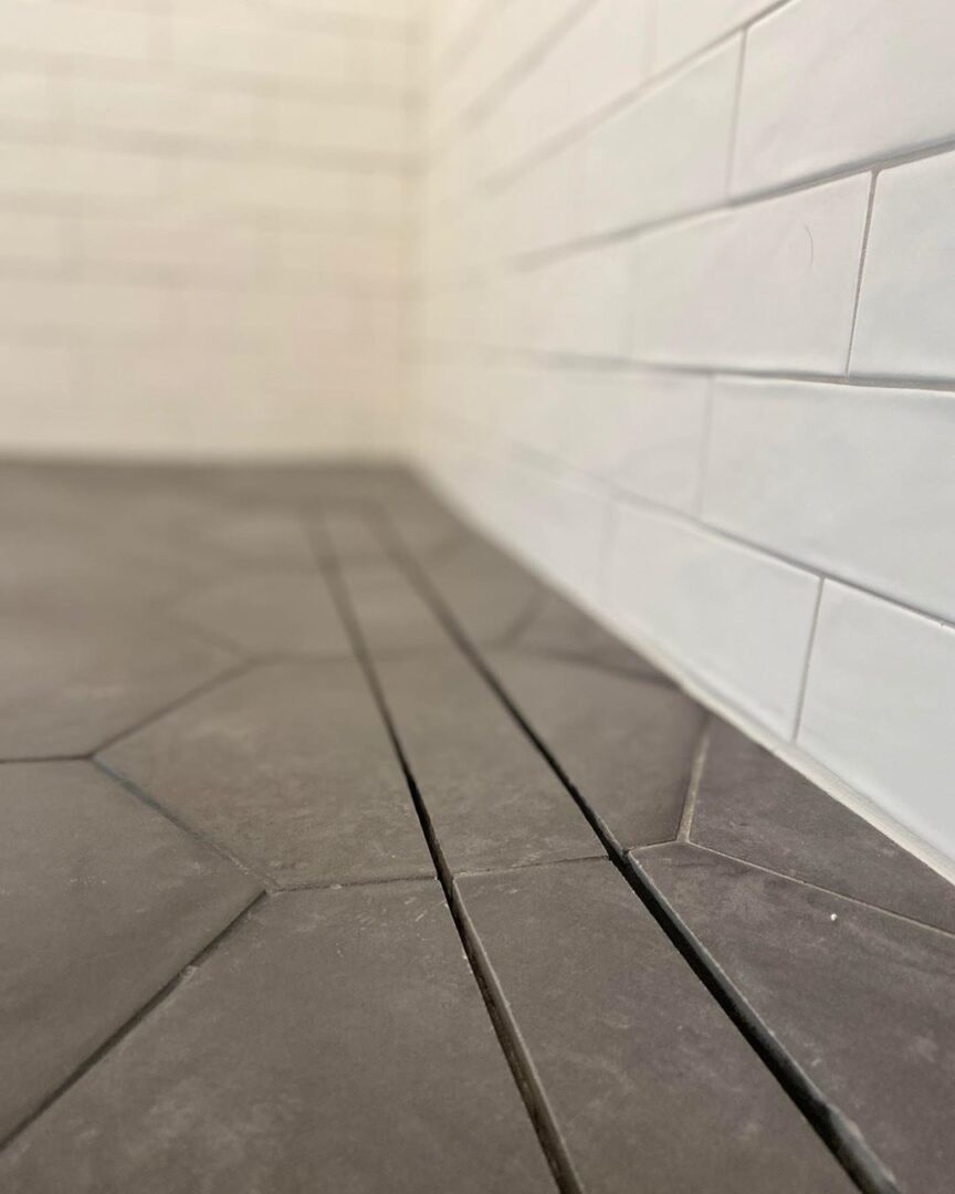 A tile floor with a crack isolation membrane installed below the surface.