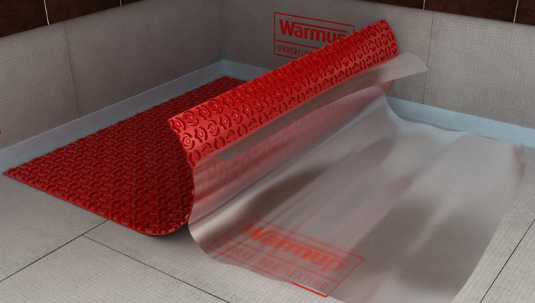 A Warmup Membrane being installed over a subfloor.