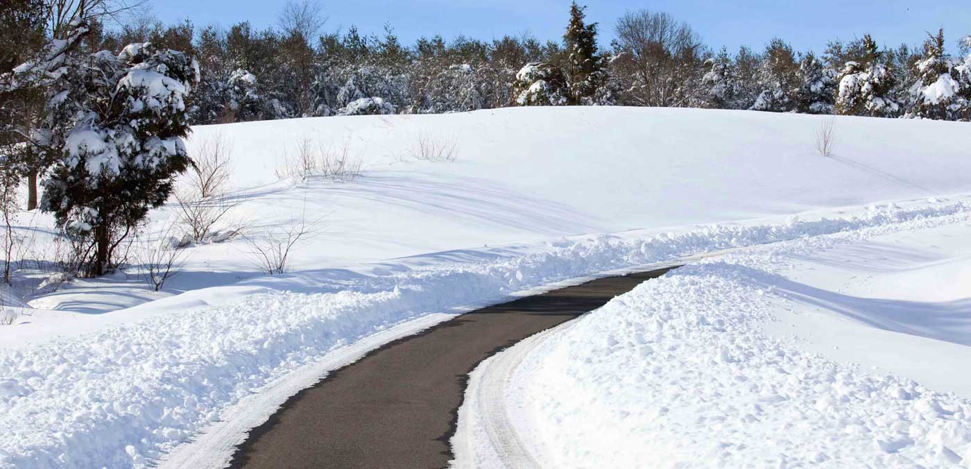 Snow removal of a long driveway.