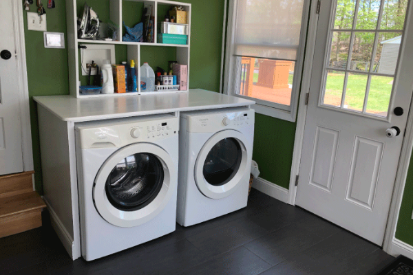 two washing machines in laundry room