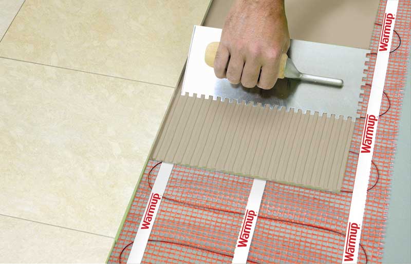 Installation of Warmup's StickyMat Underfloor Heating Mat under tile.