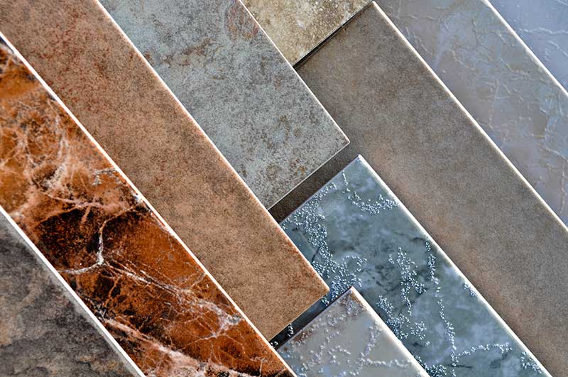 A cascade of floor different floor tiles.